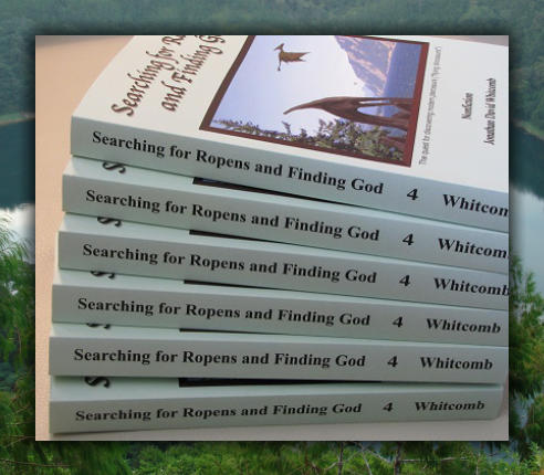 Stack of copies of the nonfiction paperback book "Searching for Ropens and Finding God" by Jonathan Whitcomb